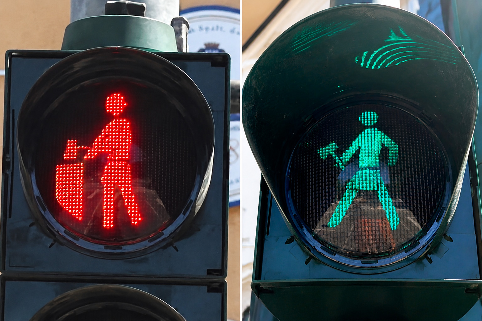 Zwei Ampeln mit Piktogrammen sind nebeneinander zu sehen. Links zeigt das rote Licht eine stilisierte Figur und einem Hammer in einem ausgestrecktem Arm, rechts zeigt das grüne Licht eine Figur mit einer Schürze und gehobenem Arm, die einen Hammer hält. Beide Piktogramme sind klar und kontrastreich dargestellt.